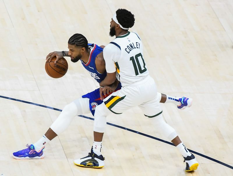 Paul George of the LA Clippers goes up against Mike Conley of the Utah Jazz