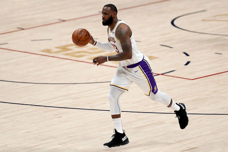 LeBron James #23 of the Los Angeles Lakers advances the ball against the Denver Nuggets (Photo by Matthew Stockman/Getty Images)