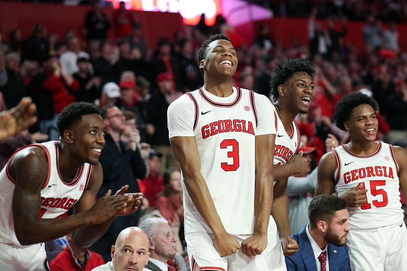 The Georgia Bulldogs bench reacts to a basket