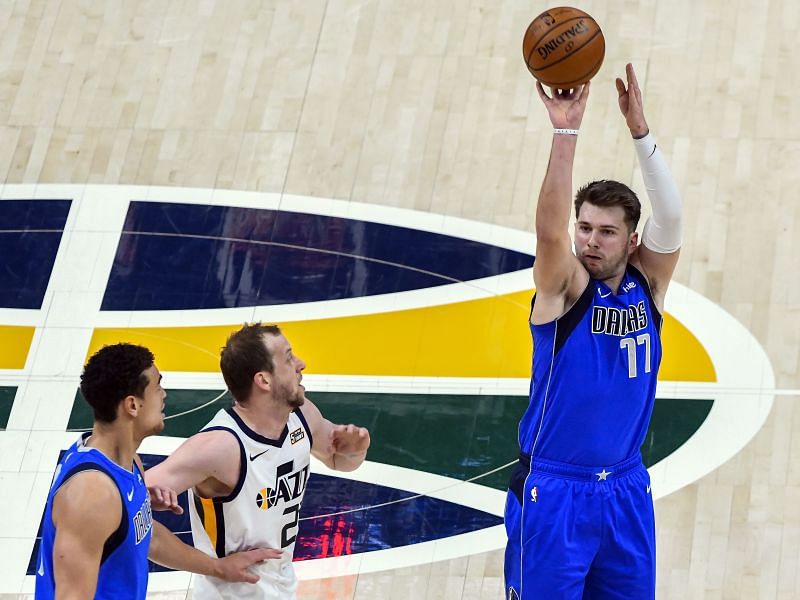 Luka Doncic of the Dallas Mavericks shoots over Joe Ingles of the Utah Jazz