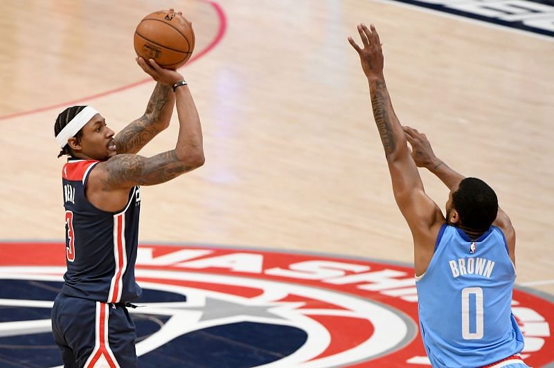 Bradley Beal #3 of the Washington Wizards shoots in front of Sterling Brown #0 of the Houston Rockets.