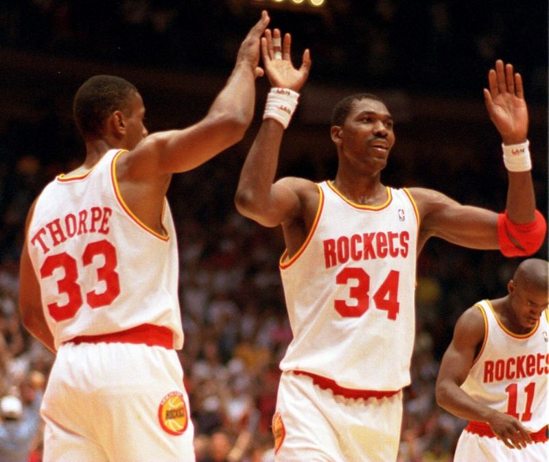 Houston Rockets (#34) Hakeem Olajuwon and (#33) Thorpe