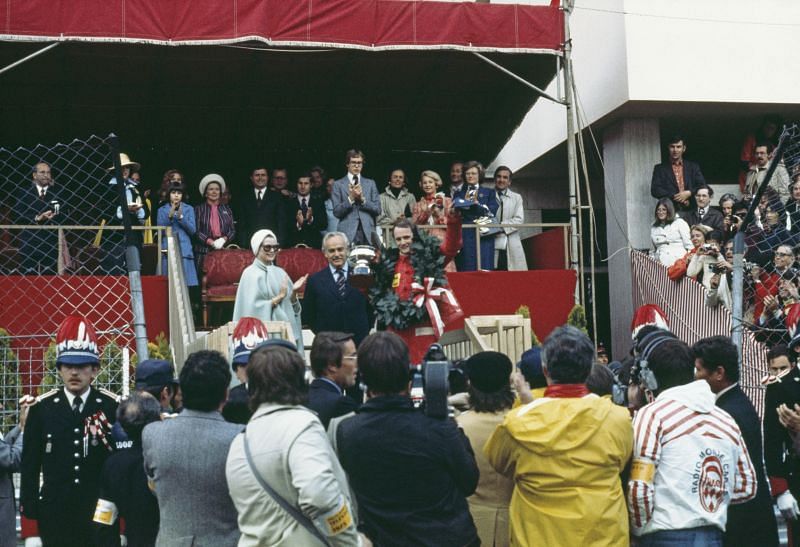 Prince Rainier III of Monaco (C) and Princess Grace (L) presenting the Monaco Grand Prix trophy to Niki Lauda in 1975