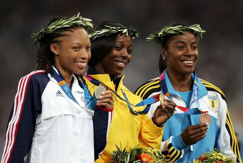 Gold medalist Veronica Campbell of Jamaica, silver medalist Allyson Felix of USA (L) and bronze medalist Debbie Ferguson of Bahamas (R) during the medal ceremony of the women&#039;s 200 metre event at the Athens 2004 Summer Olympic Games