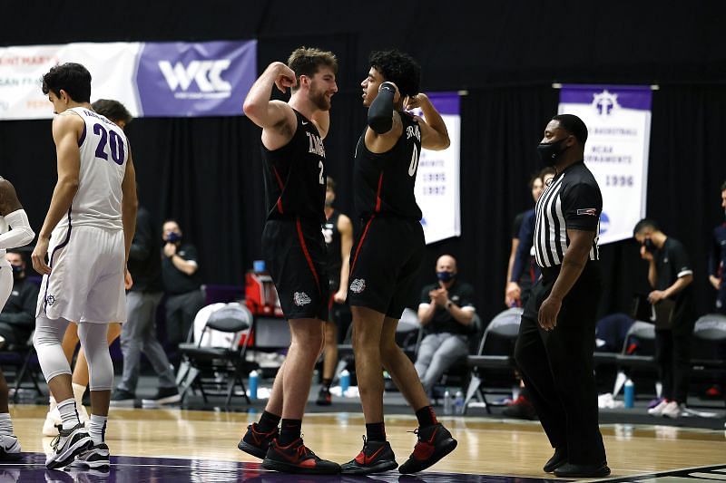 Julian Strawther #0 of the Gonzaga Bulldogs celebrates a basket and a foul with teammate Drew Timme #2