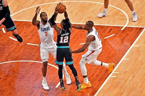 Ja Morant #12 of the Memphis Grizzlies goes to the basket against Kawhi Leonard #2 of the LA Clippers during the first half at FedExForum (Photo by Justin Ford/Getty Images)