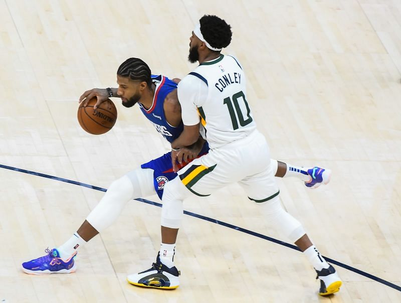 Paul George of the Los Angeles Clippers goes up against Utah Jazz&#039;s Mike Conley