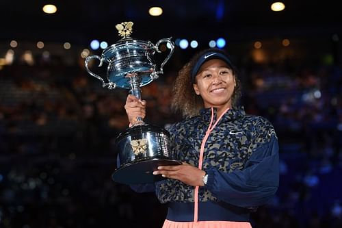 Naomi Osaka poses with the 2021 Australian Open trophy