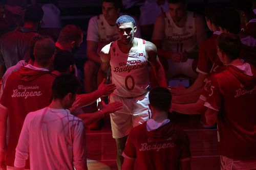 D'Mitrik Trice #0 of the Wisconsin Badgers walks onto the court during player introductions