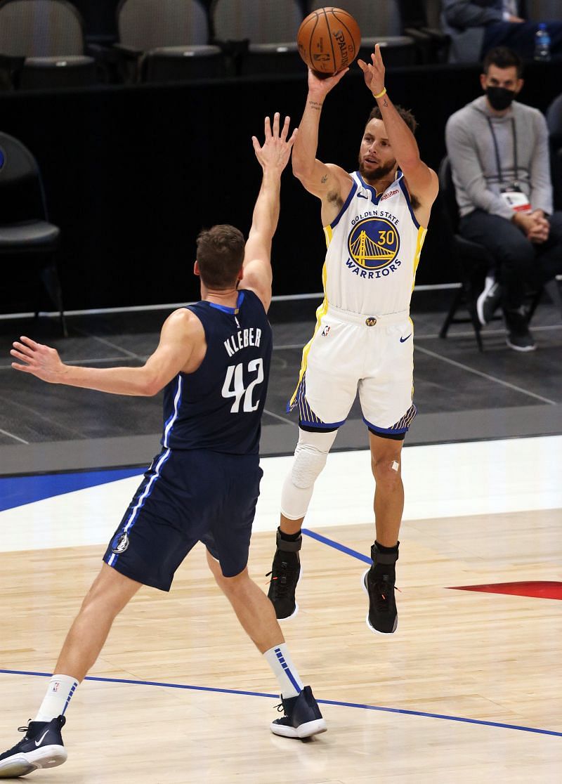 Steph Curry shoots his signature three for Golden State Warriors