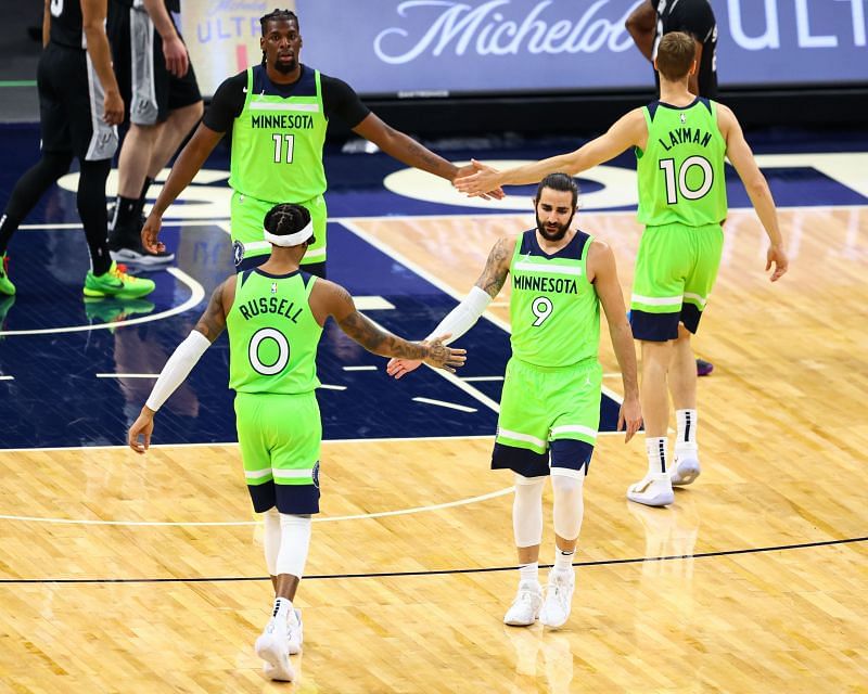 Ricky Rubio #9 of the Minnesota Timberwolves and D'Angelo Russell #0 of the Minnesota Timberwolves celebrate after a play during the second quarter against the San Antonio Spurs at Target Center (Photo by Harrison Barden/Getty Images)