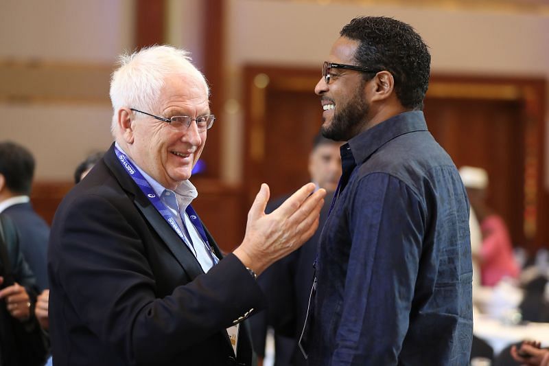 Svein Arne Hansen talks to Javier Sotomayor (R) during the 52nd IAAF Congress in September 2019 in Doha, Qatar