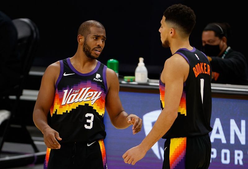 Chris Paul (#3) and Devin Booker (#1) of the Phoenix Suns