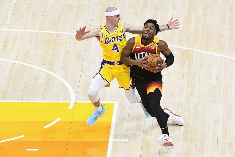 Donovan Mitchell #45 of the Utah Jazz drives past Alex Caruso #4 of the Los Angeles Lakers during a game at Vivint Smart Home Arena on February 24, 2021 in Salt Lake City, Utah. (Photo by Alex Goodlett/Getty Images)