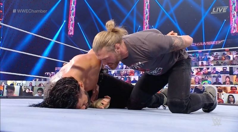 What did Edge whisper to Roman Reigns at WWE Elimination Chamber?