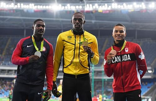 Bolt (centre), Gatlin (left) and De Grasse (right)  pose with their medals after 100m race at 201Rio Olympics