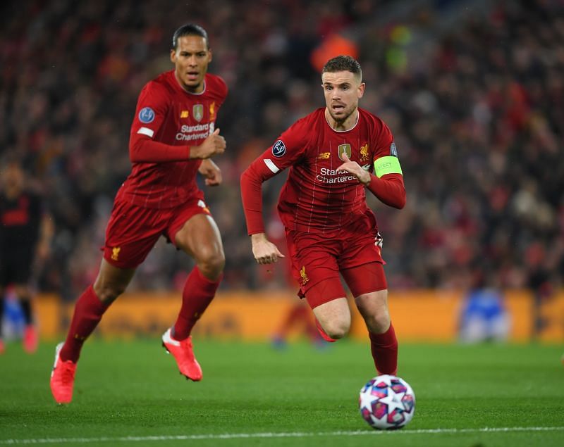 Liverpool&#039;s Virgil van Dijk (L) and Jordan Henderson