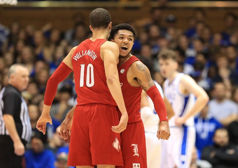 Samuell Williamson #10 of the Louisville Cardinals reacts with Lamarr Kimble #0