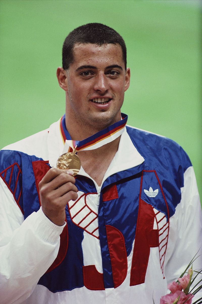 Matt Biondi of the United States celebrates with his Gold medal after winning the Men&#039;s 100 metres Freestly final during the XXIV Summer Olympic Games in Seoul