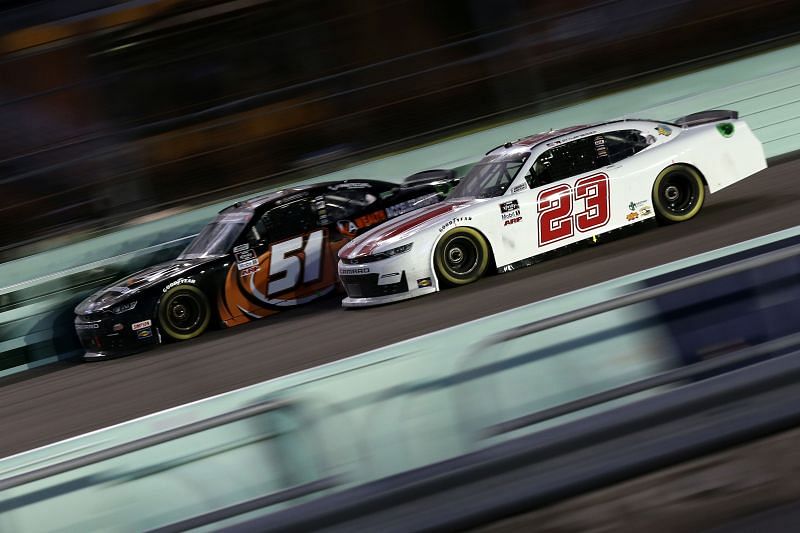 Tyler Reddick passes Jeremy Clements on the way to a second-place finish. He would fail inspection and was disqualified. (Photo by Sean Gardner/Getty Images)