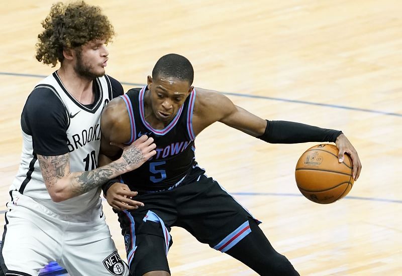 De'Aaron Fox #5 of the Sacramento Kings posts up against Tyler Johnson #10 of the Brooklyn Nets