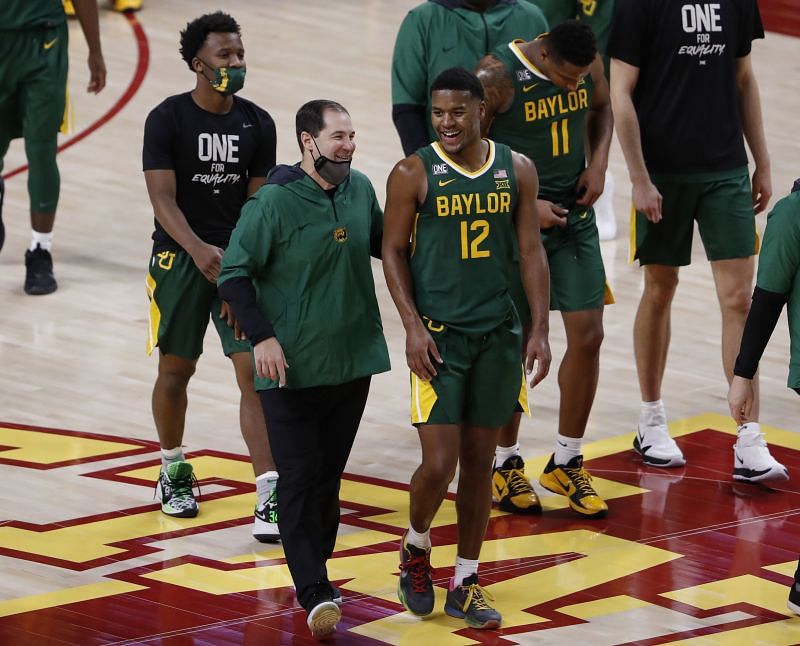 Head coach Scott Drew of the Baylor Bears walks off the court with Jared Butler #12 of the Baylor Bears