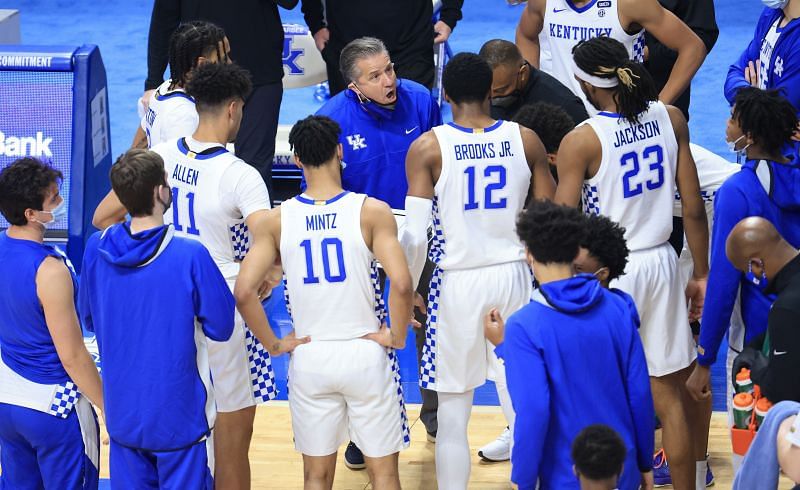 John Calipari, the head coach of the Kentucky Wildcats, gives instructions to his team.