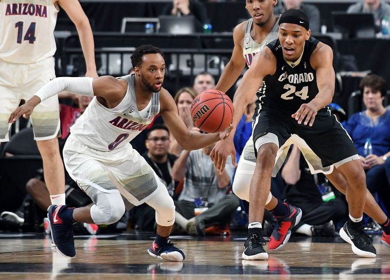 Parker Jackson-Cartwright #0 of the Arizona Wildcats steals the ball from George King #24