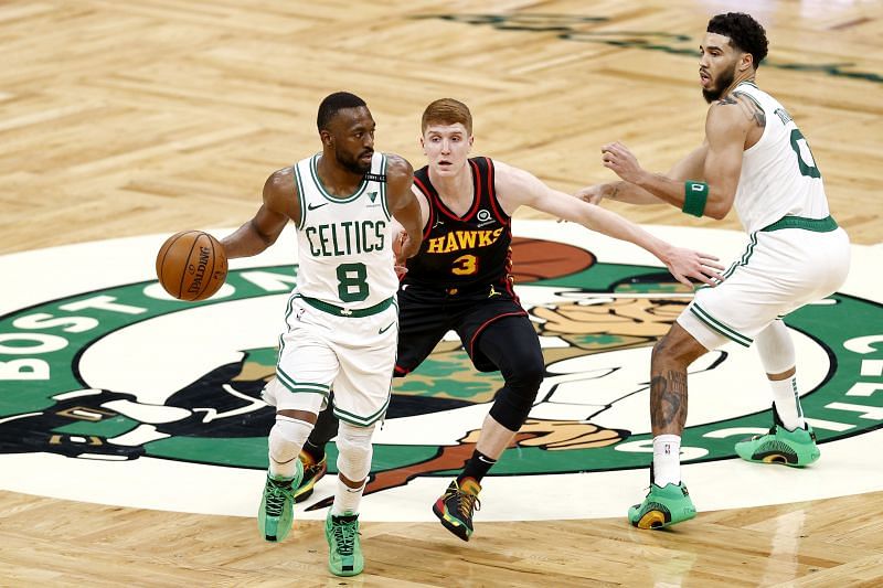 Kemba Walker #8 of the Boston Celtics dribbles downcourt past Kevin Huerter #3 of the Atlanta Hawks during the second half at TD Garden on February 19, 2021 in Boston, Massachusetts. The Celtics defeat the Hawks 121-109. (Photo by Maddie Meyer/Getty Images)