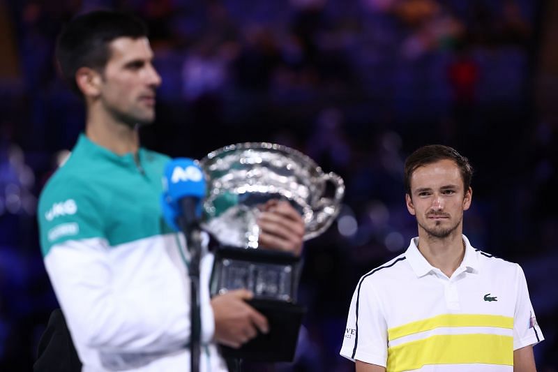 Daniil Medvedev looks on as Novak Djokovic delivers the Australian Open winner speech