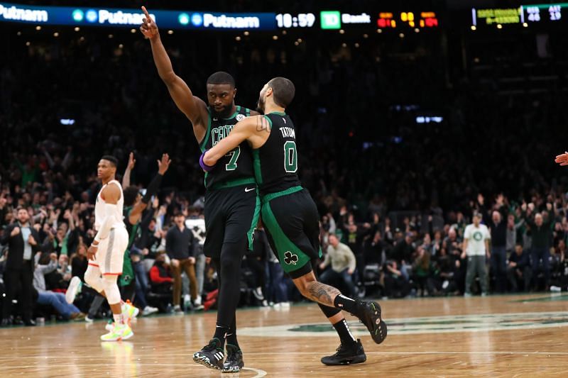 Jaylen Brown celebrates with Jayson Tatum after scoring against the Houston Rockets to send the game into overtime at TD Garden on February 29, 2020