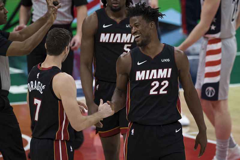 Jimmy Butler of the Miami Heat celebrates with Goran Dragic after a play against the Washington Wizards 