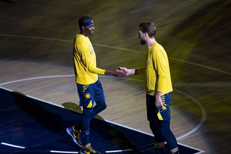 Justin Holiday (left) with Domantas Sabonis (right) of the Indiana Pacers