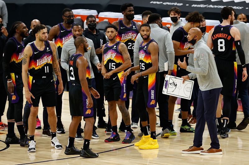 Head coach Monty Williams (R) of the Phoenix Suns talks with Jae Crowder, Abdel Nader, Chris Paul, Cameron Payne, and Mikal Bridges.