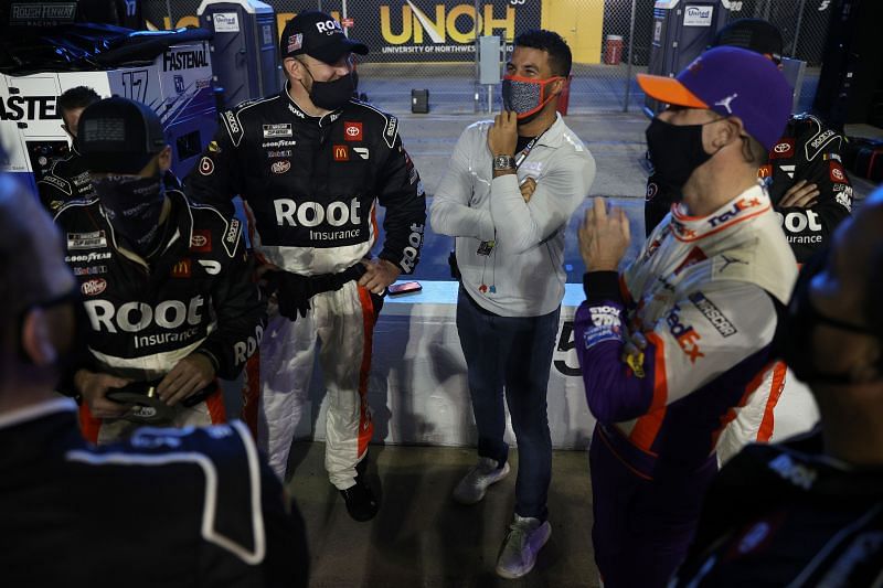 Denny Hamlin talks to Bubba Wallace prior to the Busch Clash at Daytona.