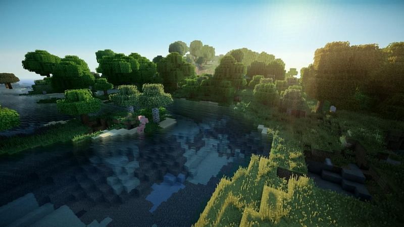 A beautiful pond in a small forest in Minecraft. (Image via wallpapercave.com)