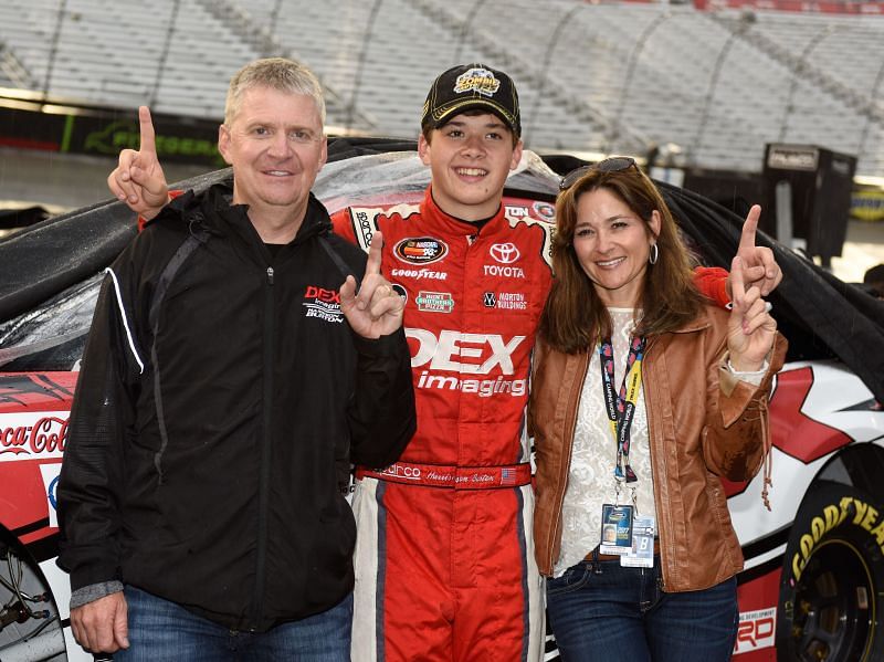 Harrison Burton with his father, Jeff, and mother, Kim. Photo/Getty Images