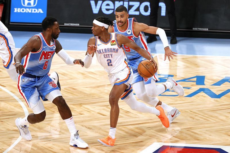 Shai Gilgeous-Alexander #2 of the Oklahoma City Thunder dribbles against Jeff Green #8 of the Brooklyn Nets during the second half at Barclays Center on January 10, 2021, in the Brooklyn borough of New York City. (Photo by Sarah Stier/Getty Images)