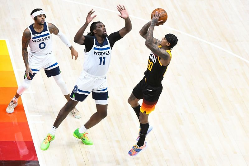 Jordan Clarkson #00 of the Utah Jazz shoots over Naz Reid #11 of the Minnesota Timberwolves during a game at Vivint Smart Home Arena on December 26, 2020 in Salt Lake City, Utah.