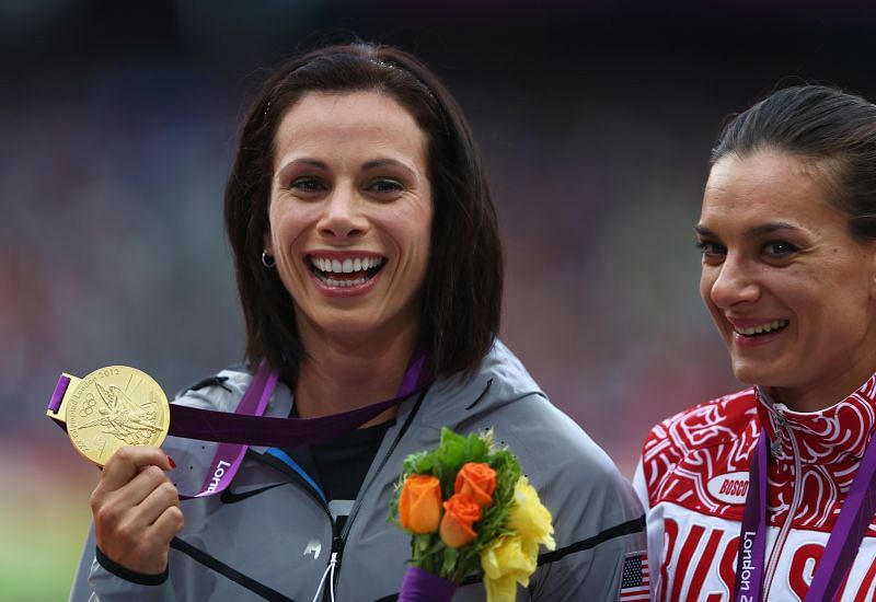 Gold medalist Jennifer Suhr of the United States (L) and bronze medalist Yelena Isinbaeva of Russia pose on the podium at the London 2012 Olympic Games