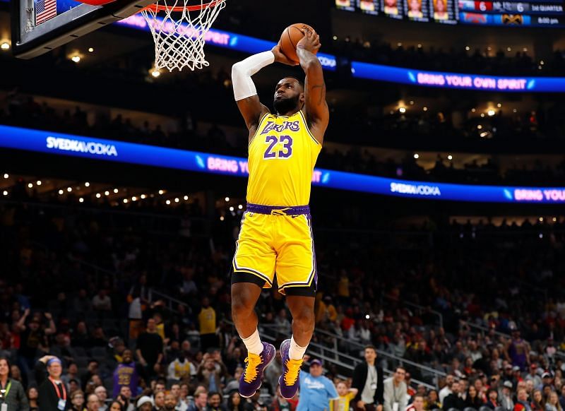 LeBron James of the LA Lakers dunks in a game against the Atlanta Hawks.