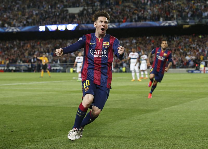 Lionel Messi exults after scoring a goal in the Champions League