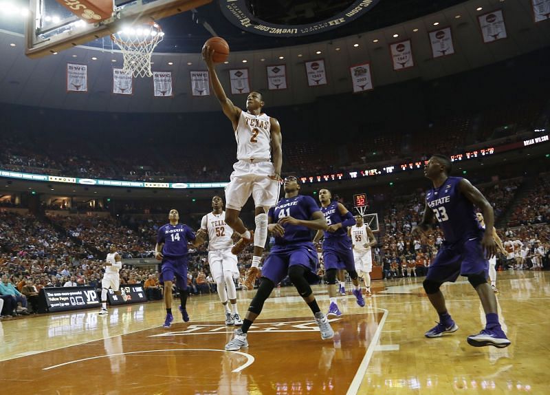 The Texas Longhorns shoot a layup against the Kansas State Wildcats.