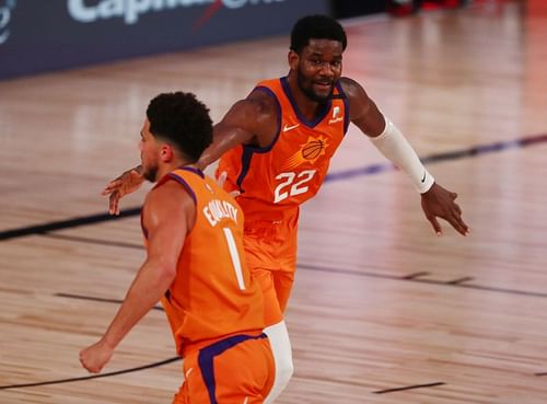 Deandre Ayton #22 of the Phoenix Suns is congratulated by Devin Booker #1