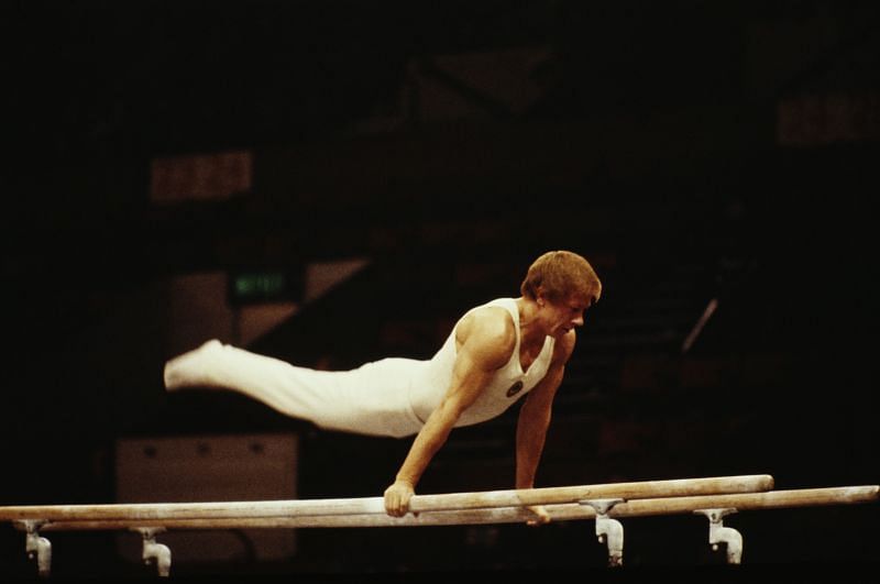 Nikolai Andrianov of the Soviet Union performs during the Men&#039;s Parallel bars event in 1978 during the World Artistic Gymnastics Championships in Strasbourg, France