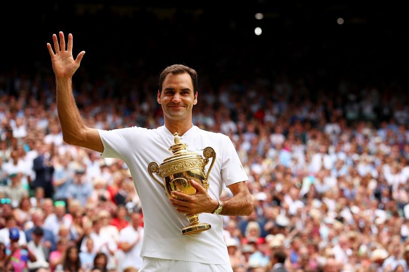 Roger Federer celebrates victory with the Wimbledon trophy in 2017