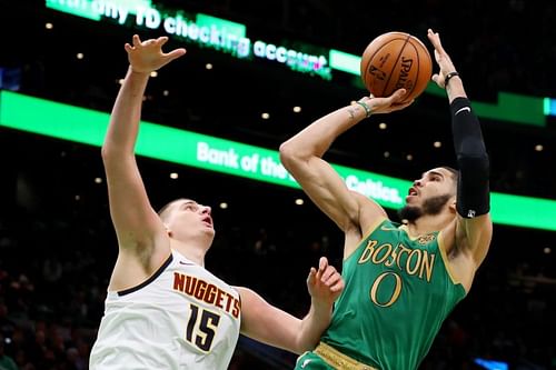 Jayson Tatum of the Boston Celtics takes a shot over Nikola Jokic of the Denver Nuggets during the second half at TD Garden on December 06, 2019, in Boston, Massachusetts. (Photo by Maddie Meyer/Getty Images)