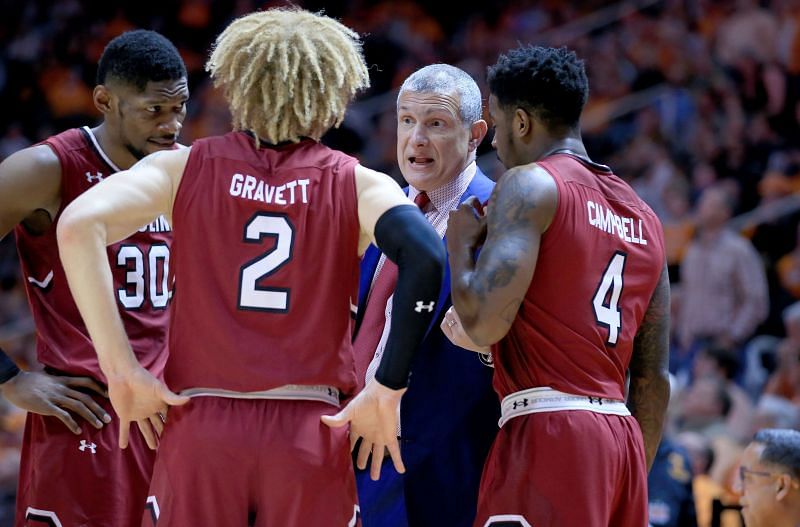Frank Martin, the head coach of the South Carolina Gamecocks, gives his team instructions against the Tennessee Volunteers.