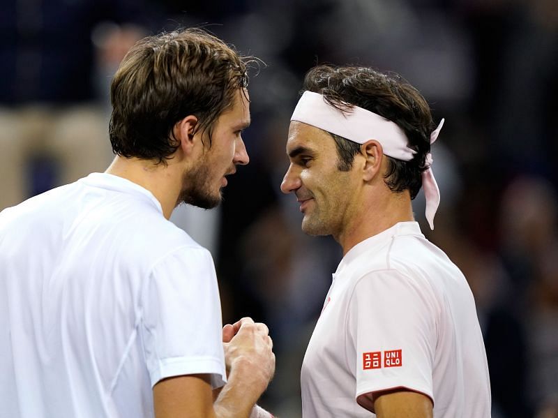 Daniil Medvedev shakes hands with Roger Federer