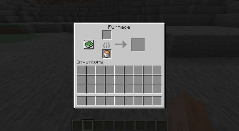 A lava bucket placed inside of a furnace to serve as the fuel source. (Image via Minecraft)